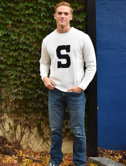 Alan Paine Varsity S Sweater in Ivory, featuring a black letter "S" on the chest.