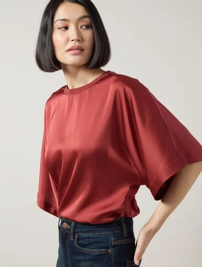 Lyssé Ginger Mixed Media Dolman Tee in red color with dark blue denim jeans.
