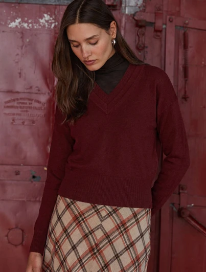 Autumn Cashmere Long Sleeve Double Vee Sweater in burgundy, showcasing a casual autumnal outfit.