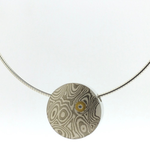 18k white gold and silver mokume gane small discus pendant with 22k gold and diamond detail