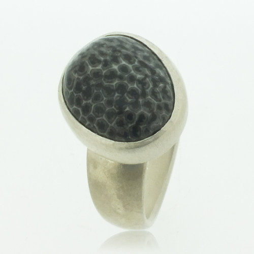 Heavy silver ring with fossilised coral stone in silver pod setting