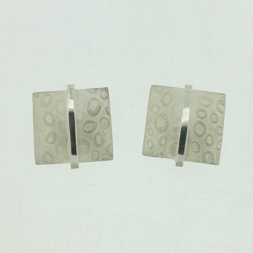 Large square textured silver stud earrings with polished bar