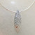 18k white gold and silver mokume gane mandorla pendant with a ruby in 22k gold setting 