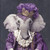 Lady Elephant with a crown featuring gold accents, a layered and detailed outfit