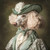 Poodle with a green and white themed outfit, including a hat with a large, delic