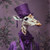 Lady giraffe with a lavish, ornate outfit featuring shades of purple, including
