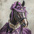 Lady Horse in a lavender outfit with a lace-like overlay and a rose accessory,