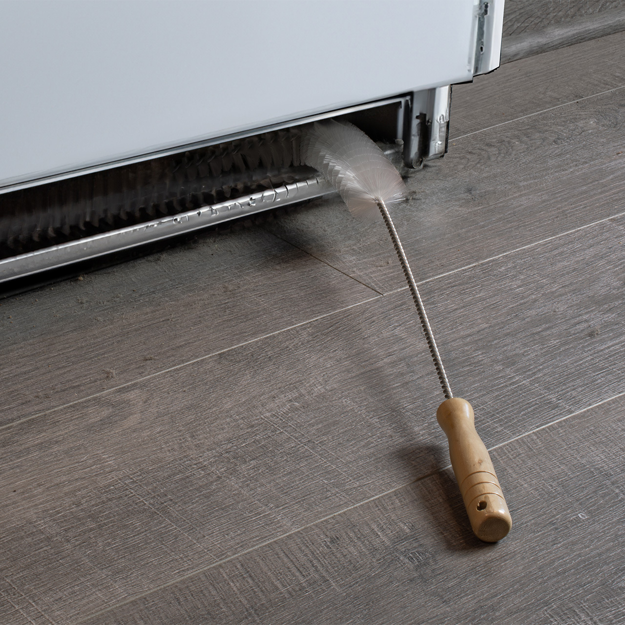 Coil Cleaning Brush cleaning under refridgerator