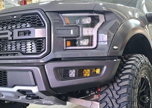ORA Triple Bezel Fog Light Kit installed on a Ford Raptor
