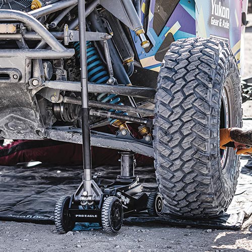 Pro Eagle 3 Ton Kratos Off-Road Jack in use on an off-road vehicle