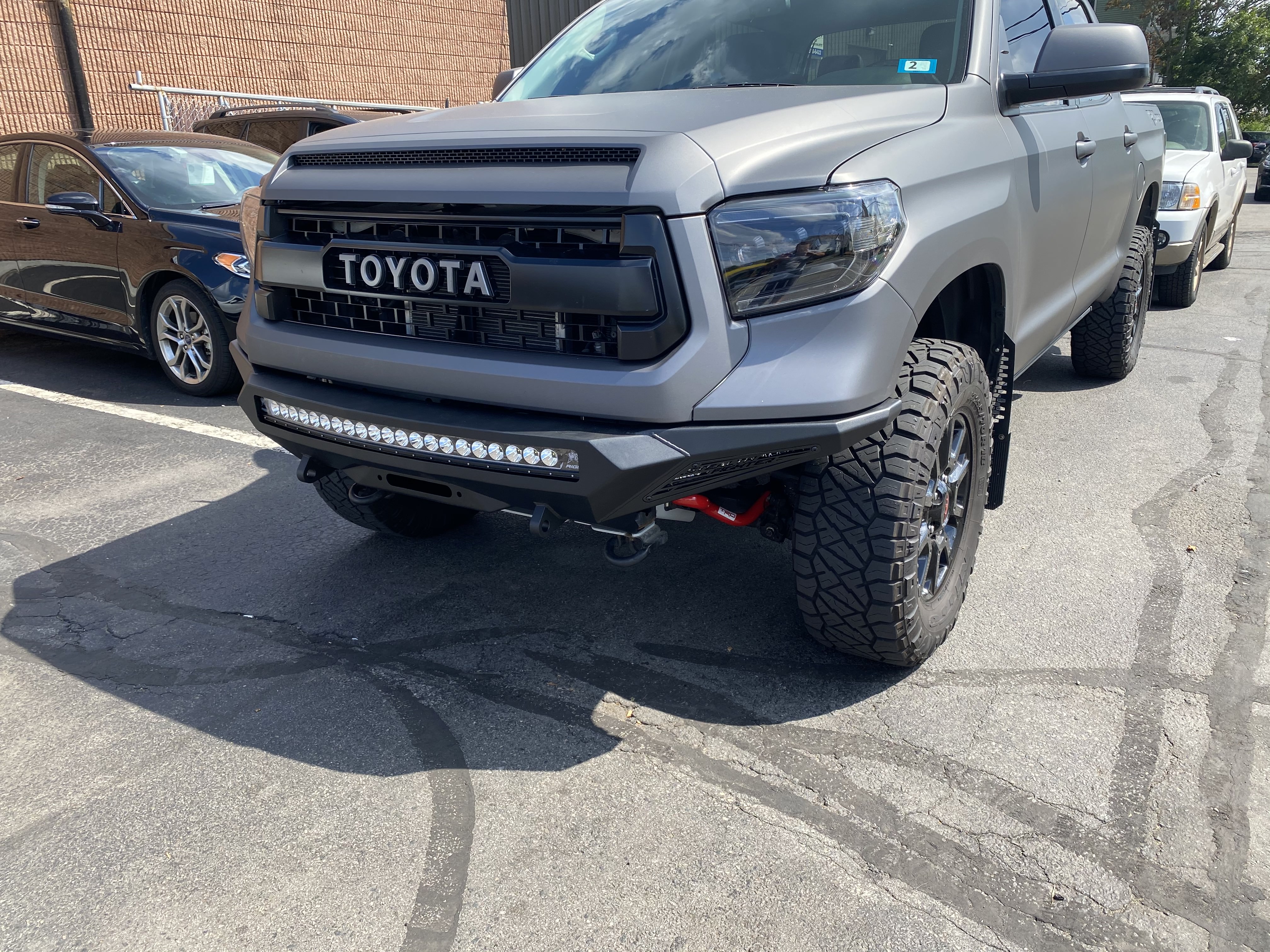 
Grey Toyota Tundra with Addictive Desert Designs Front and Rear Stealth Fighter Bumper and Rigid Lighting
