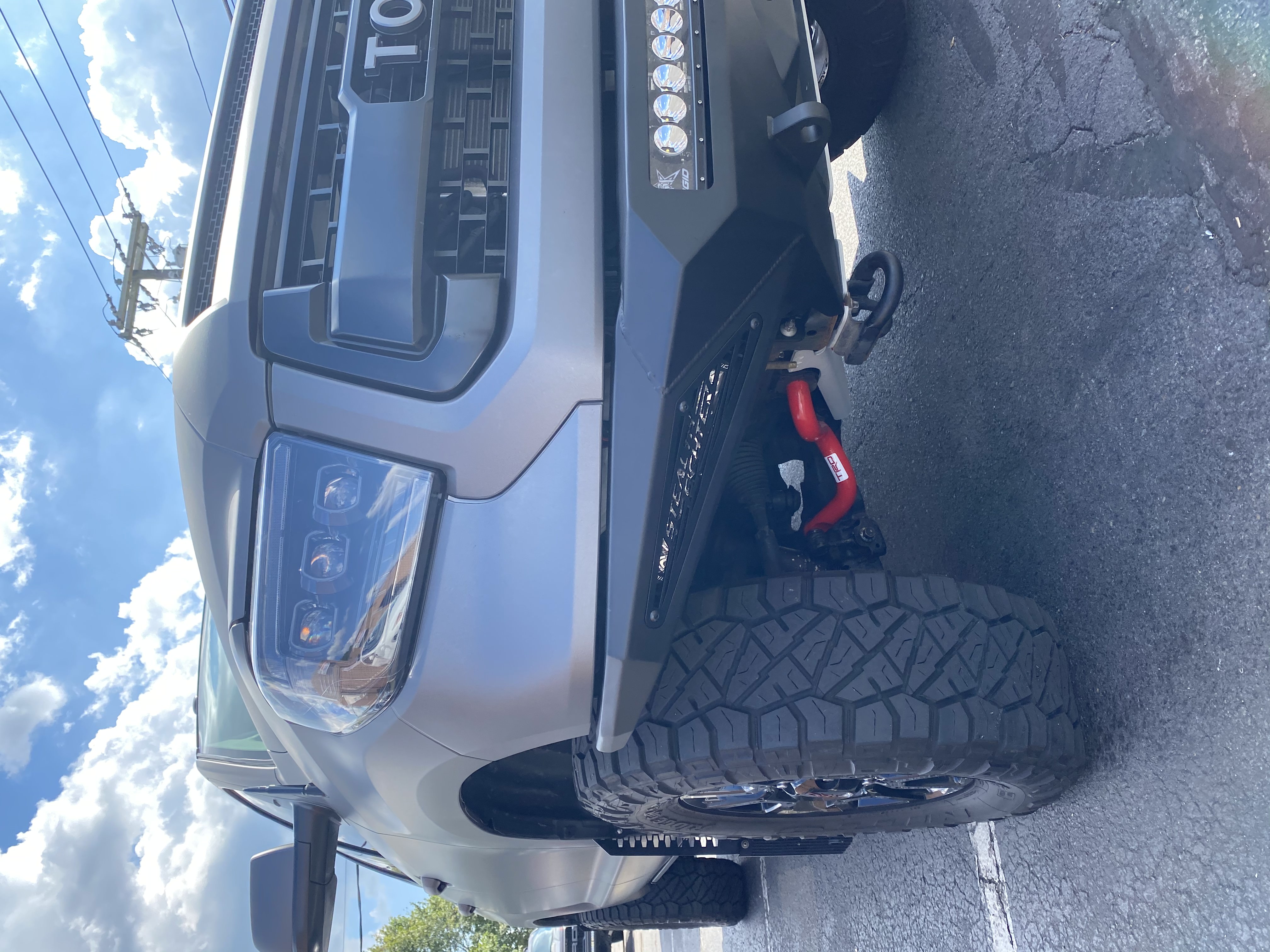
Grey Toyota Tundra with Addictive Desert Designs Front and Rear Stealth Fighter Bumper and Rigid Lighting
