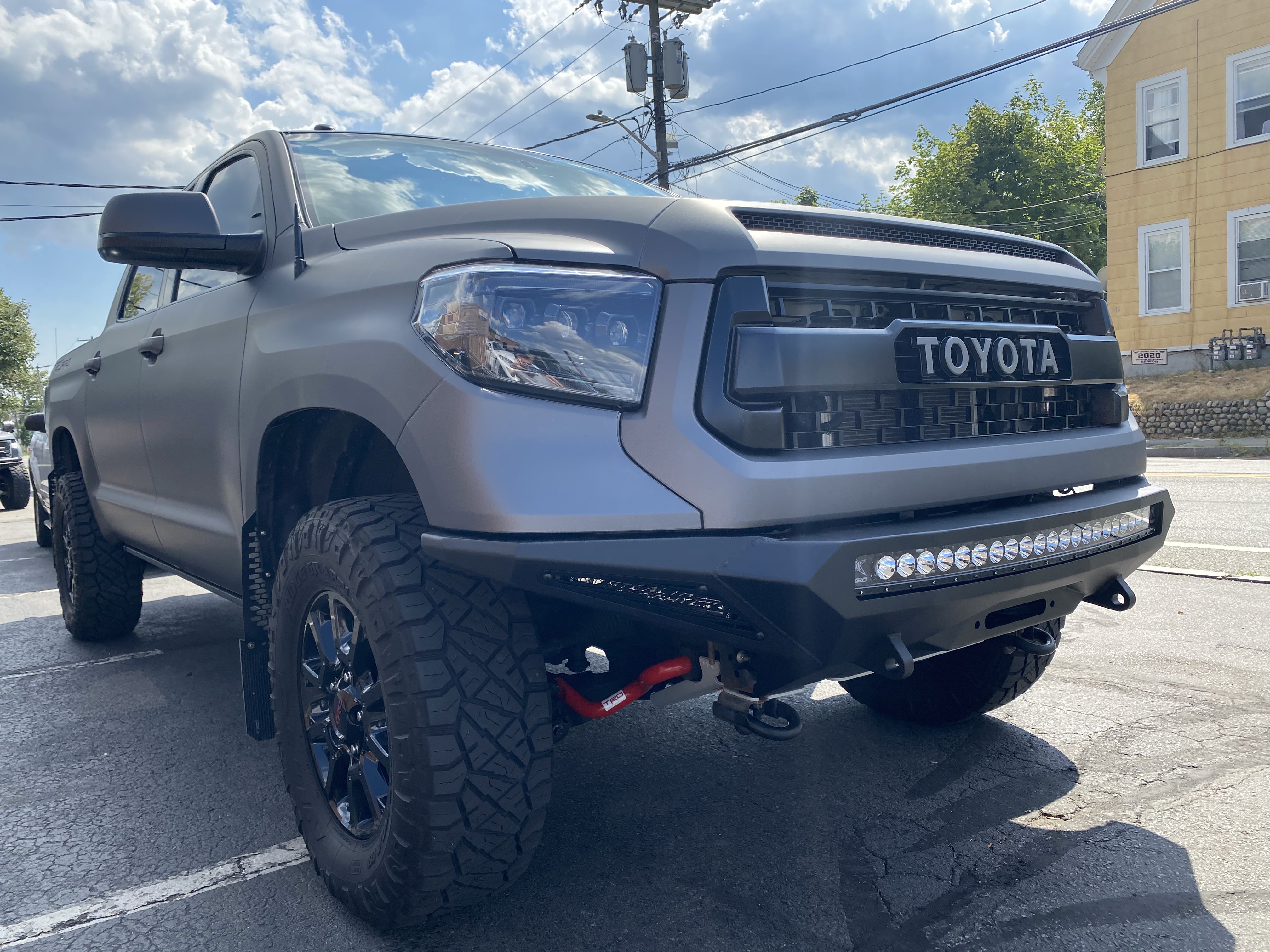 
Grey Toyota Tundra with Addictive Desert Designs Front and Rear Stealth Fighter Bumper and Rigid Lighting

