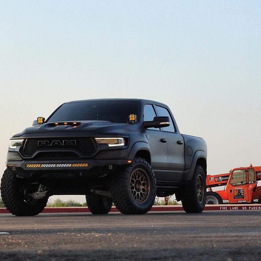 Matte Black Ram TRX with Addictive Desert Designs front and rear bumpers and Baja Designs Lighting 