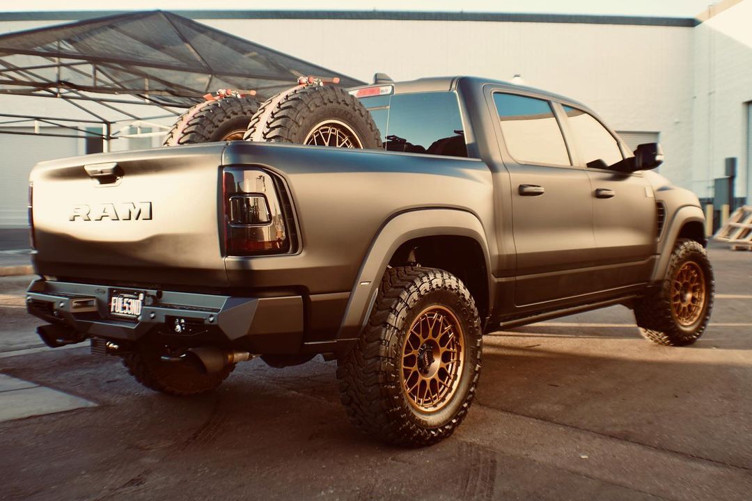 Matte Black Ram TRX with Addictive Desert Designs front and rear bumpers and Baja Designs Lighting 