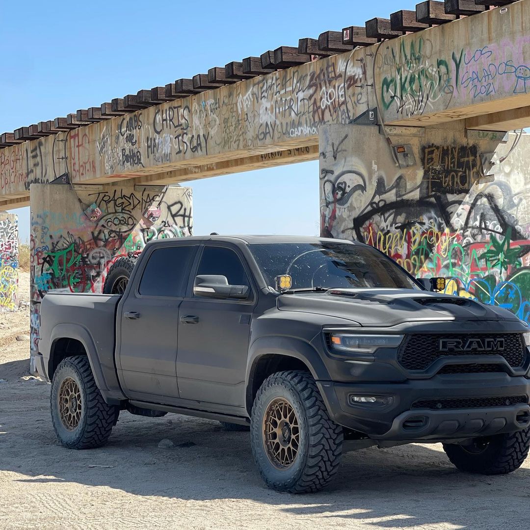 Matte Black Ram TRX with Addictive Desert Designs front and rear bumpers and Baja Designs Lighting 