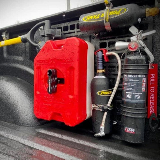 MOLLE panels installed in a truck bed with off-roading equipment strapped in