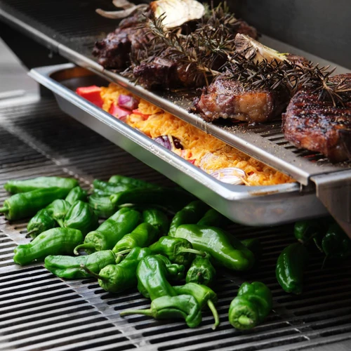 Flammkraft Zwilling Model D Gas Grill | Integrated, all-purpose oven trays for baking up sides, veggies and moreoiled