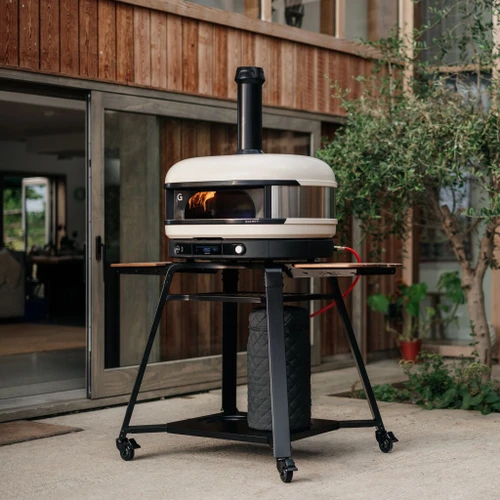 Gozney Dome XL Dual-Fuel Outdoor Oven | Rechargeable lithium battery powers both the dock and wood module. Universally compatible. Easy to swap. No wires. No apps.