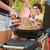 Napoleon Travel Q Gas Grill with Scissor Cart | Napoleon’s iconic cast iron cooking grids provide even heat, prevent food from falling through, and create beautifully distinctive sear marks