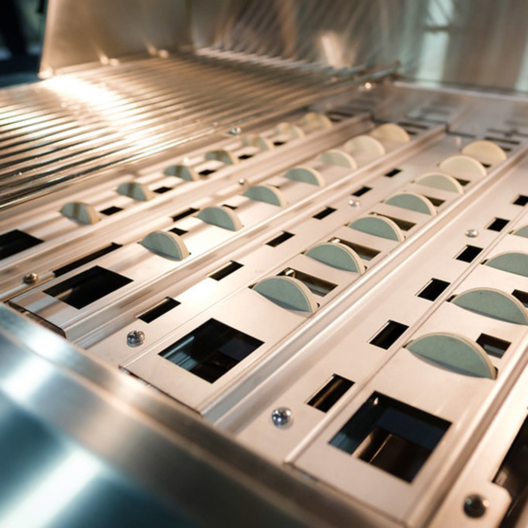Aspire by Hestan 36" Built-In Gas Grill | Patent-pending symmetrical flip-to-clean radiant tray generates sizzling flavor with ceramic disc briquettes.