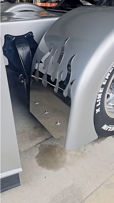 Freightliner Cascadia truck with custom stainless steel flame fender guards fabricated by 4 State Trucks