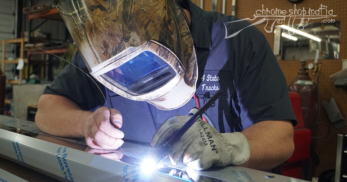 Chrome Shop Mafia worker welding fabricated metal in 4 State Trucks shop to create custom chrome truck parts