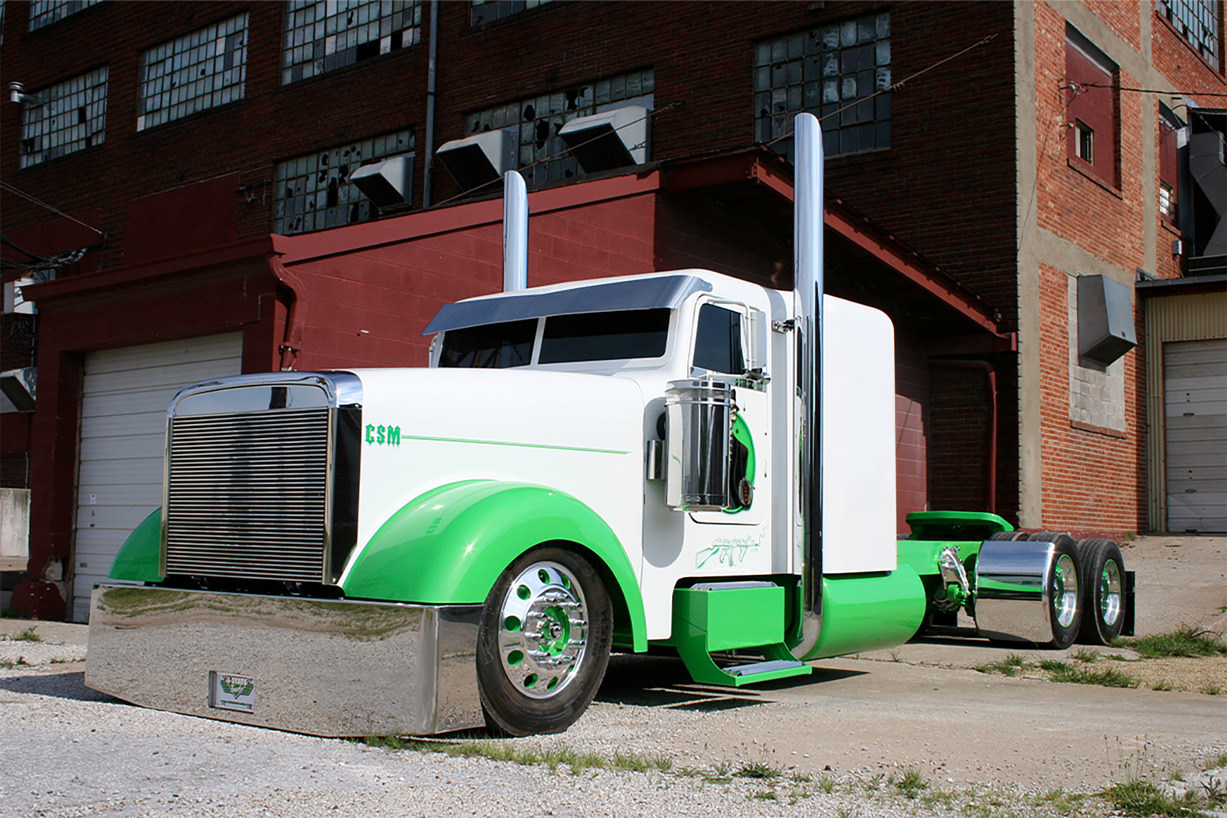The Mob Sled custom show truck from Trick My Truck parked at 4 State Trucks before being displayed above the Chrome Shop Mafia sign