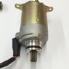 TrailMaster 150 XRS & 150 XRX Starter Motor, a metallic cylindrical electric starter with mounting brackets and a gear protruding from the bottom.