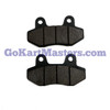 TrailMaster MB200-2 Brake Pad Set/Hydro, two black brake pads with worn friction surfaces for scooter or ATV braking system.