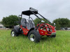 TrailMaster Go Kart 200E XRX Go Kart, red off-road vehicle with roll cage and dual seats on a grassy field.