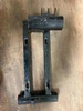 Trailmaster Mini XRX Engine Mounting Plate, black metal engine mounting plate with mounting holes and cylindrical support tube.