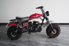 TrailMaster Hurricane 200X Mini Bike, red and black mini dirt bike with off-road tires and racing decals.