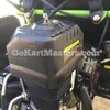 Product ASSEMBLED TrailMaster Mini XRX/R+ Go Kart with Reverse for Ages 4+ featuring a black and green frame and an engine with a visible air filter and warning label.