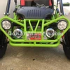 Assembled TrailMaster Mini XRX/R+ Go Kart with Reverse for ages 4 and up, front view showing bright green frame, dual headlights, and black seat.