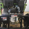 TrailMaster Mini XRX/R+ Go Kart with Reverse, assembled close-up view showing engine and mechanical components.