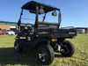 Trailmaster Taurus 200U, utility side-by-side UTV with a cargo bed, black color, two-seat design, off-road tires, and a protective roof, suitable for farm and outdoor work.