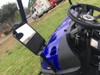 Trailmaster Taurus 200U Utility SXS UTV, close-up of the vehicle's interior and steering wheel with side mirror, outdoors on grass field.