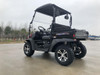 Trailmaster Taurus 200U Utility SXS UTV, black off-road utility vehicle with rugged tires and cargo bed.