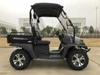 Trailmaster Taurus 200U utility side-by-side vehicle, rugged design with off-road tires and open cab, suitable for utility and recreational use.