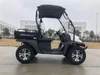Trailmaster Taurus 200U, utility SXS UTV vehicle with rugged tires and a cargo bed, designed for off-road utility and work tasks.