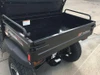 Trailmaster Taurus 200U Utility SXS UTV, cargo bed with black finish and safety rails for off-road utility tasks.