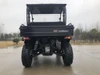 Trailmaster Taurus 200U utility side-by-side vehicle, front view showing rugged tires, suspension, and cargo bed with brand logo, suitable for off-road utility tasks.