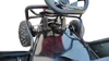 TrailMaster Cheetah 3 Kids Go-Kart, close-up view of the steering wheel, pedal system, and front tires.
