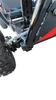 TrailMaster Cheetah 3 Kids Go-Kart, close-up view of the black chassis and rear wheel showing the suspension and tire tread.