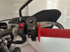 TrailMaster TM35X-250 Deluxe Dual-Sport Dirt Bike, close-up of the handlebar with a red grip, throttle, and control switches.