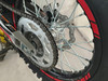 TrailMaster TM35X-250 Deluxe Dual-Sport Dirt Bike, close-up view of the rear wheel, chain, and disc brake.