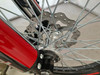 TrailMaster TM35X-250 Deluxe Dual-Sport Dirt Bike, close-up of front wheel, disc brake and spokes.