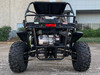 TrailMaster Cheetah 300EX Deluxe EFI Go-Kart/UTV Crossover, front view of the off-road vehicle showing large rugged tires, black frame, and engine components.
