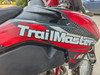 TrailMaster TM38EX (300 EFI) Deluxe Dual-Sport Dirt Bike, close-up of the side with red, black, and gray graphics.
